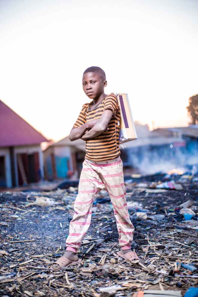 man standing on tree branches