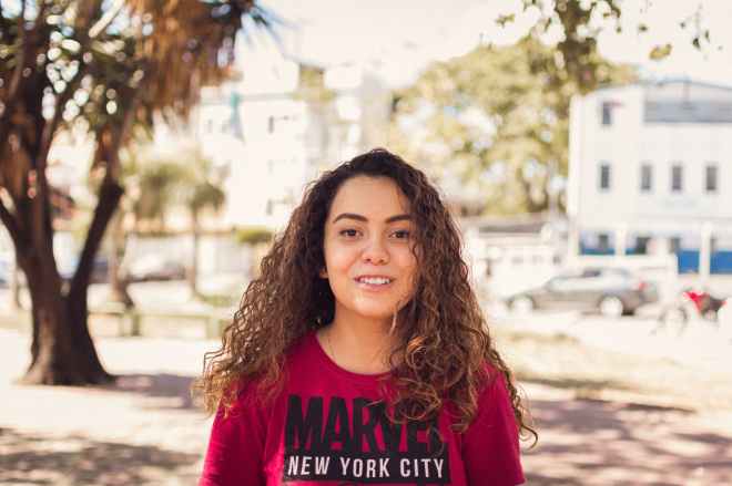 woman smiling under tree in tilt shift photography