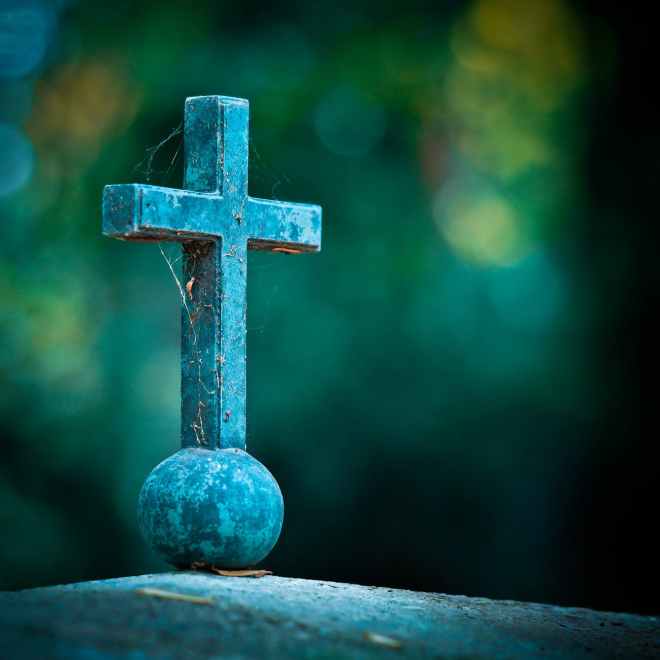 selective photo of teal cross decor