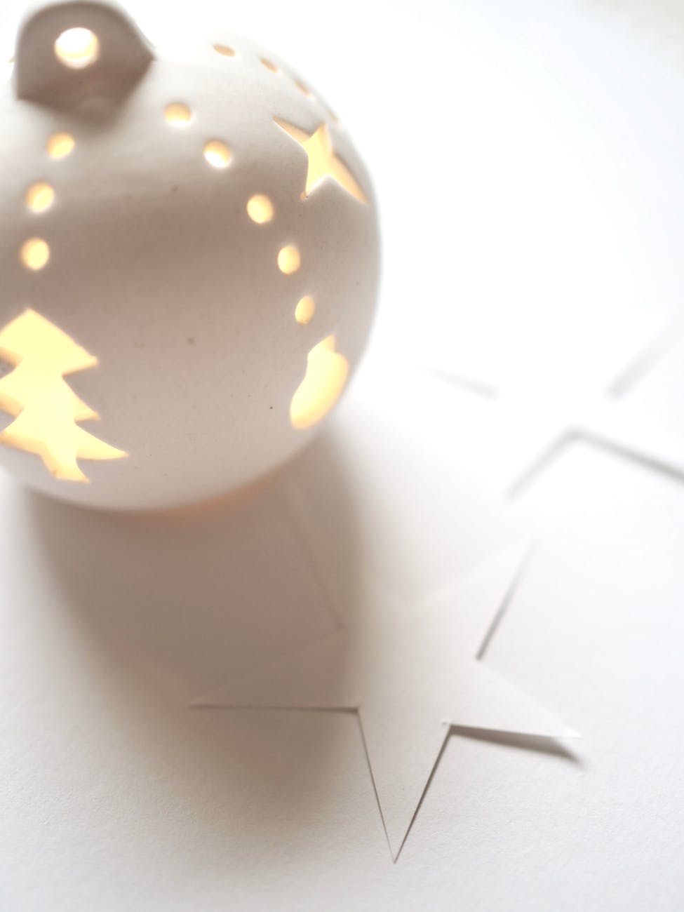white christmas baubles on white surface
