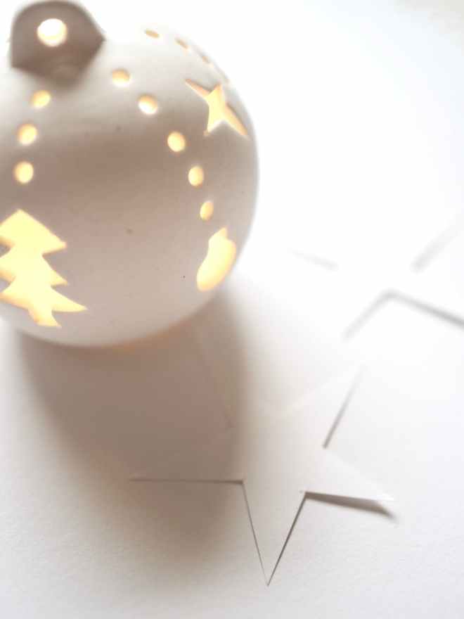 white christmas baubles on white surface